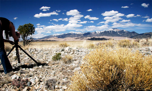 photographer in desert landscape